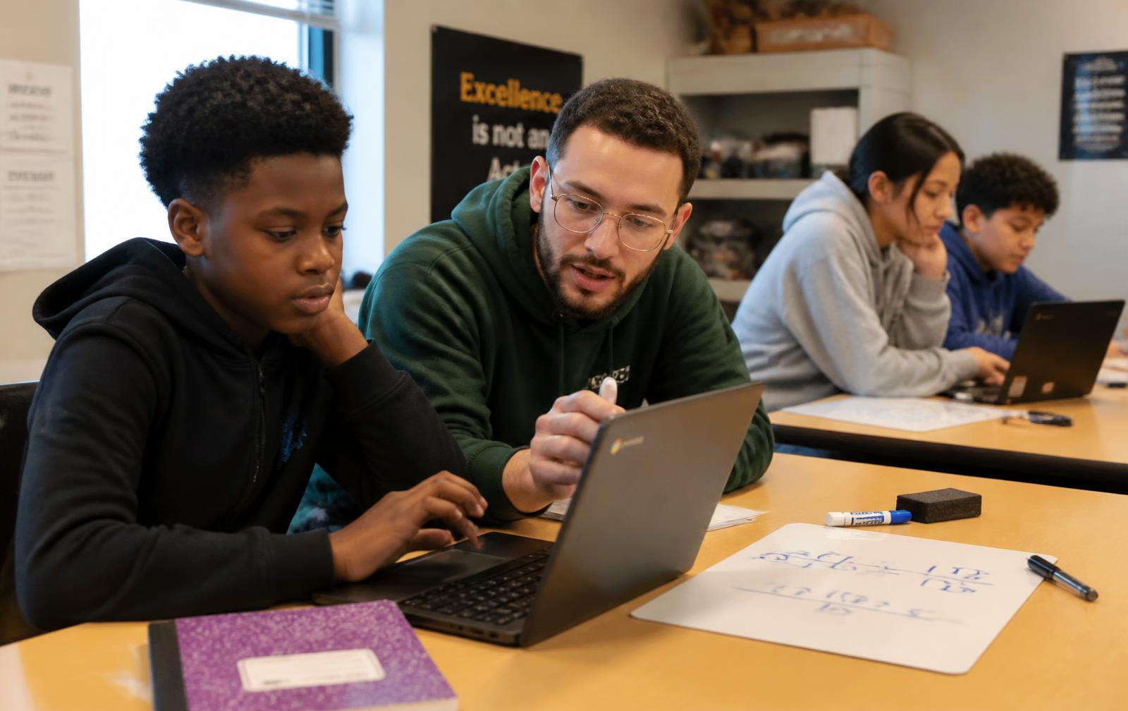 A tutor helping a student with math